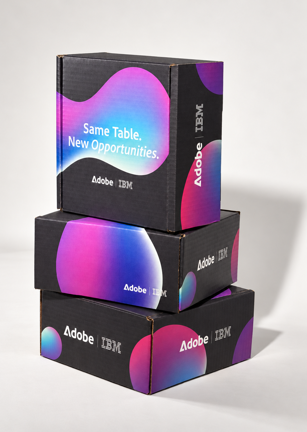 Three stacked experience kit boxes printed with Same Table. New Opportunities.